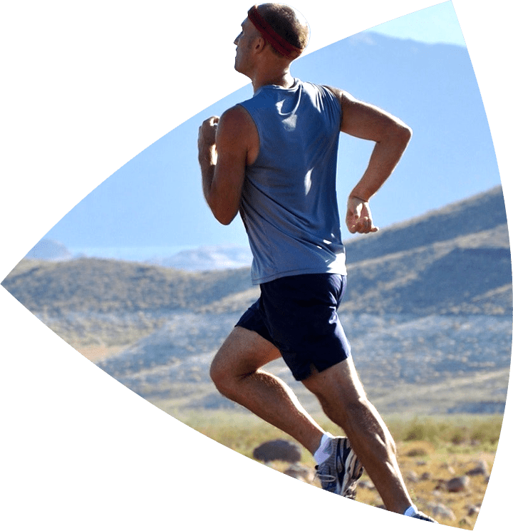 man running with headband on outside on a sunny day for Health and Wellness Care